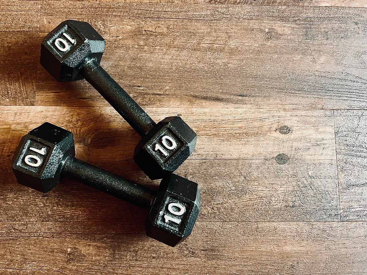 cast iron dumbbells on floor