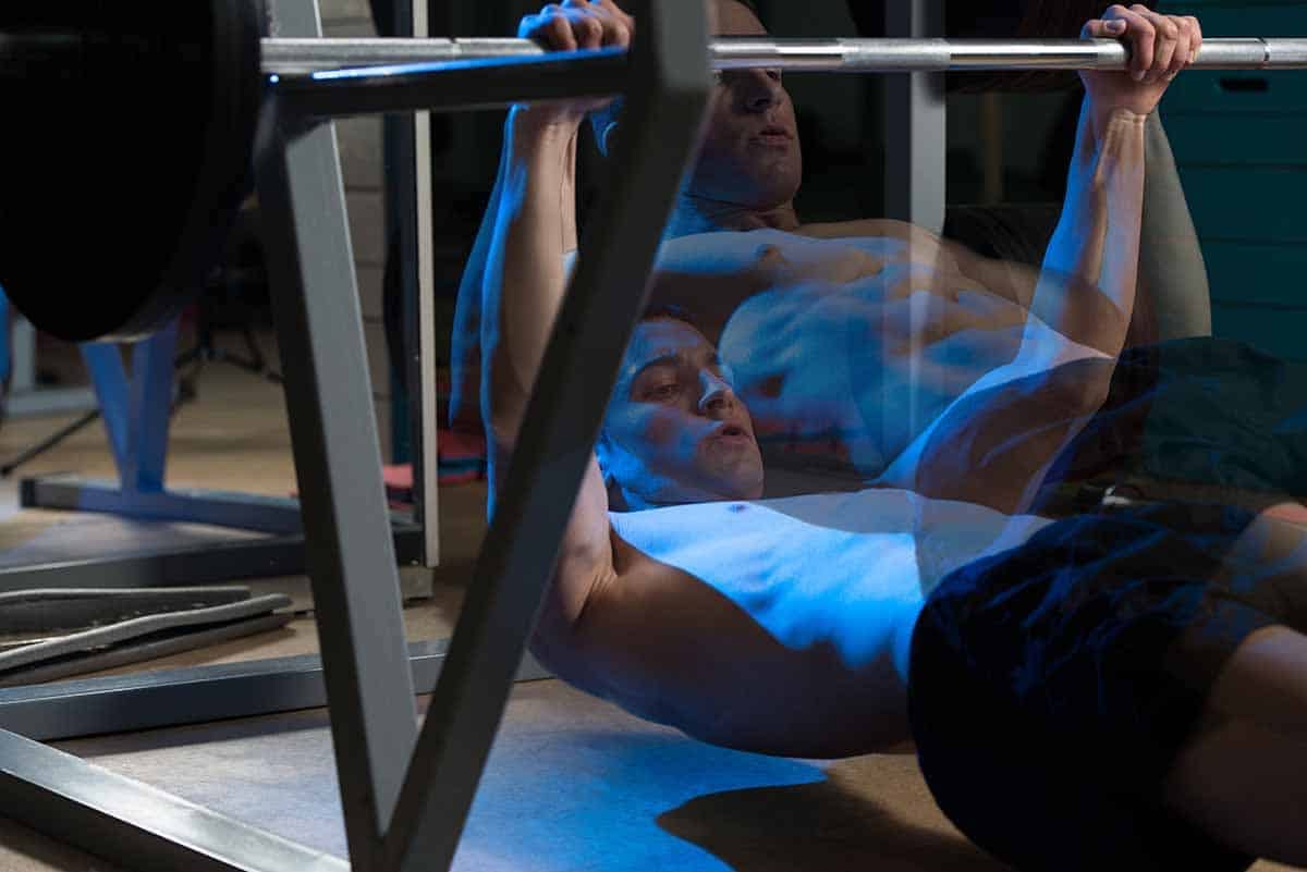 Man doing inverted rows as an alternative to pull-up 